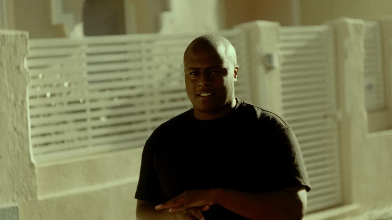 druh AM standing outdoors in warm light.